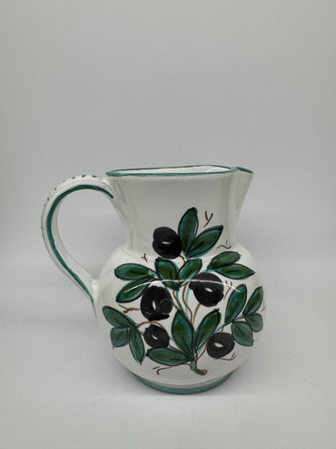 Pitcher olives white background