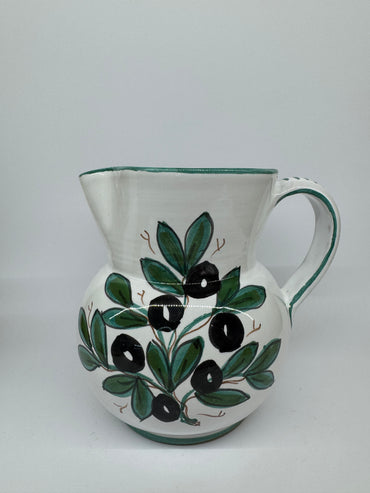 Pitcher olives white background