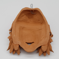 Peasant mask with poppies and ears of wheat in terracotta