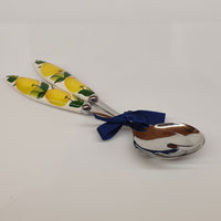 Pair of serving cutlery with lemon decoration