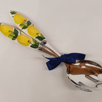 Pair of serving cutlery with lemon decoration