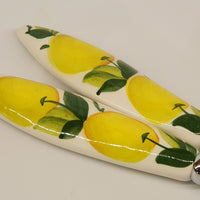 Pair of serving cutlery with lemon decoration