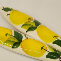 Pair of serving cutlery with lemon decoration