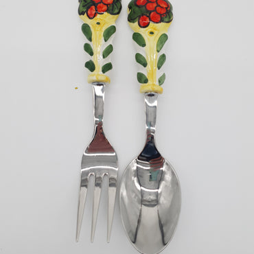 Pair of Cutlery for Serving Meat Red Grapes Yellow Background Steel and Ceramic