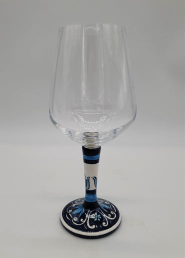 Glass for Wine Ceramic and White Graffiti Glass on a Blue Background