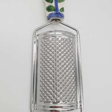 Sunflower Cheese Grater blue background Steel and Ceramic