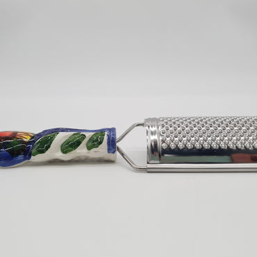 Sunflower Cheese Grater blue background Steel and Ceramic