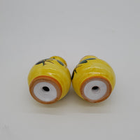 Salt and Pepper Set with Olive Decoration Yellow Background