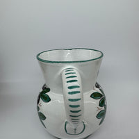 Pitcher olives white background