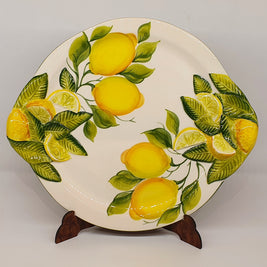 Large round tray with handles with relief lemon decoration