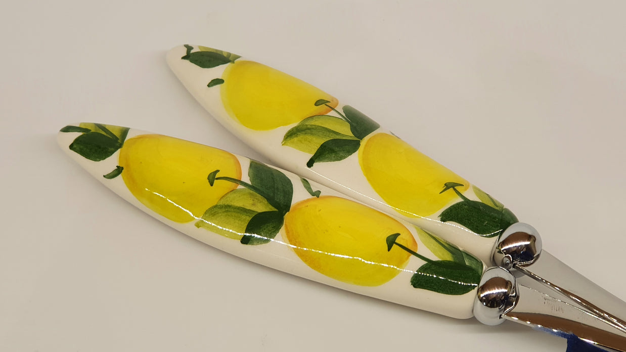 Pair of serving cutlery with lemon decoration