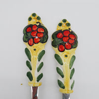 Pair of Cutlery for Serving Meat Red Grapes Yellow Background Steel and Ceramic