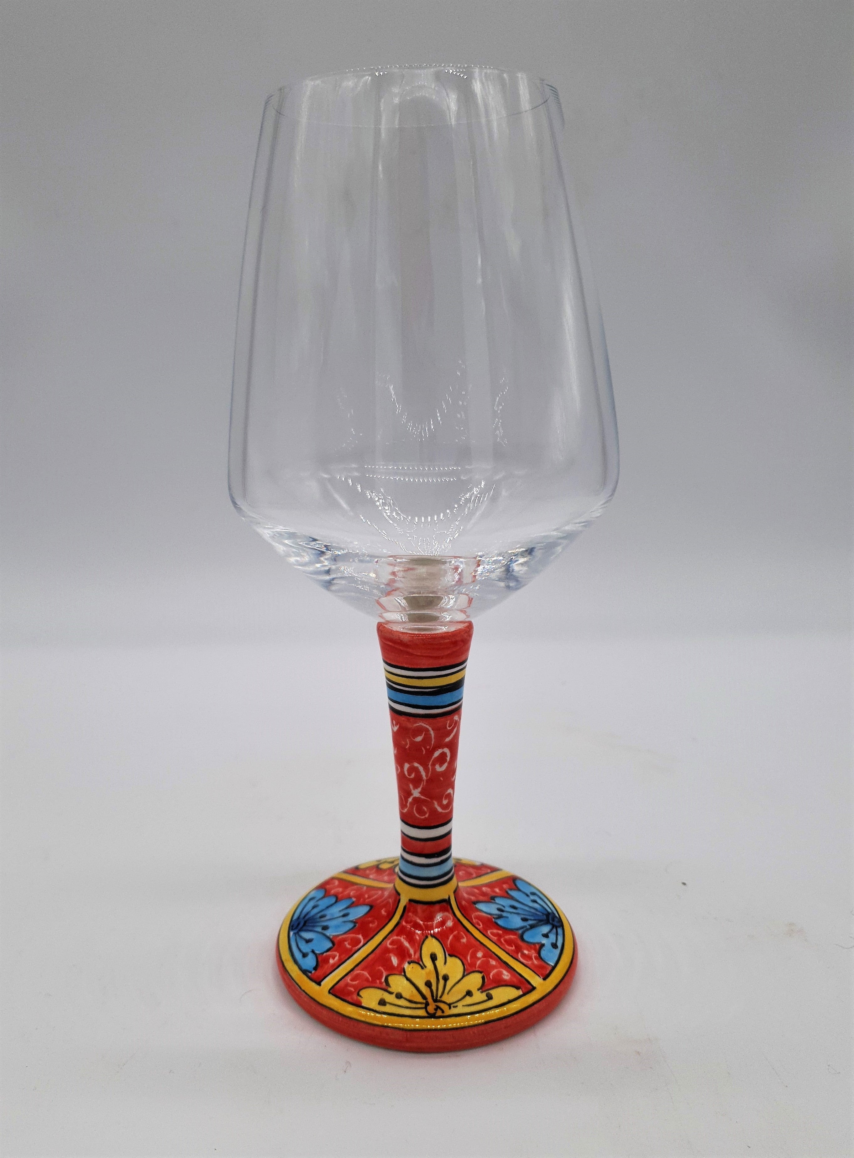 Wine Glass Ceramic and Glass Blue and Yellow Leaves Red Background