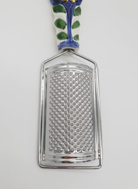 Sunflower Cheese Grater blue background Steel and Ceramic